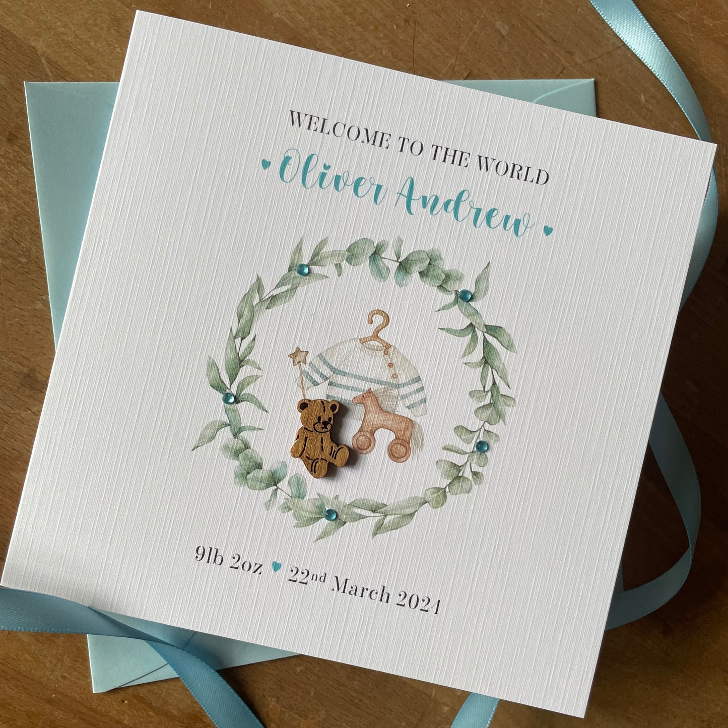 Personalised New Baby Boy Card, Wreath & Teddy - Blue - New Baby Grandson, Godson, Nephew